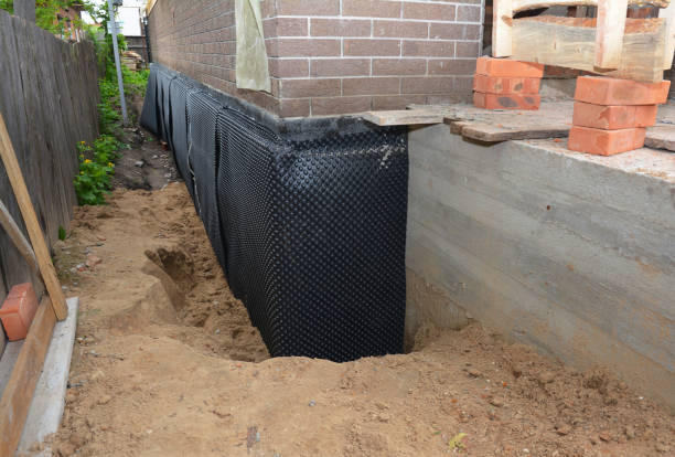 Happy homeowners after waterproofing job in Bentley